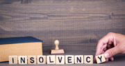 insolvency. Wooden letters on dark background